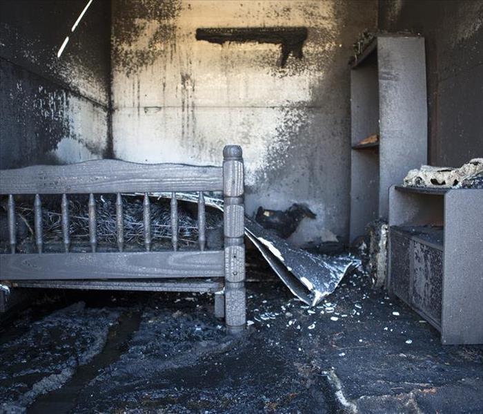 Fire and soot damage in a bedroom