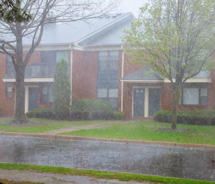 Apartment building during strong winds and heavy rainfall