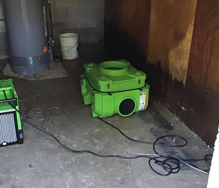 SERVPRO equipment in a basement with water damage. 